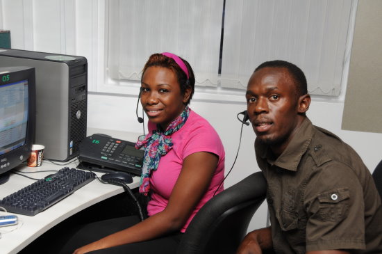 The Fastest Man in the World takes some time out to chat to a Digicel Customer as he visits the call centre -  Negril Travel Guide - Negril, Jamaica WI - NegrilTravelGuide.com - http://www.negriltravelguide.com - info@negriltravelguide.com